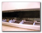 How do you repair the drain pan of a refrigerator?