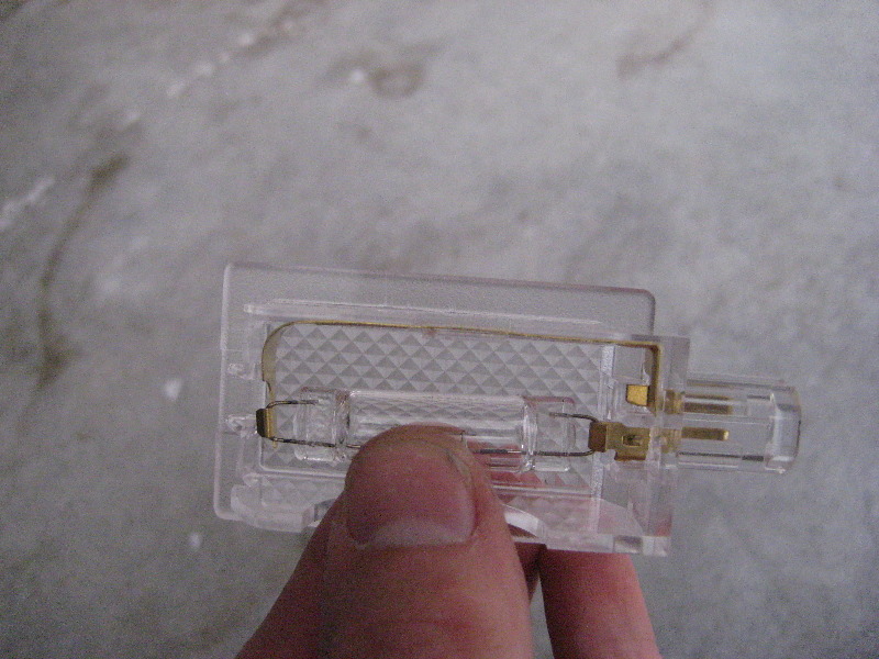 2011-2014-Dodge-Charger-Door-Courtesy-Step-Light-Bulb-Replacement-Guide-008