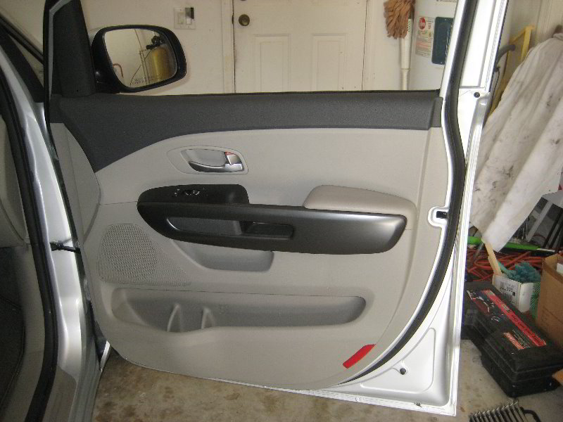 Kia-Sedona-Interior-Door-Panel-Removal-Guide-039